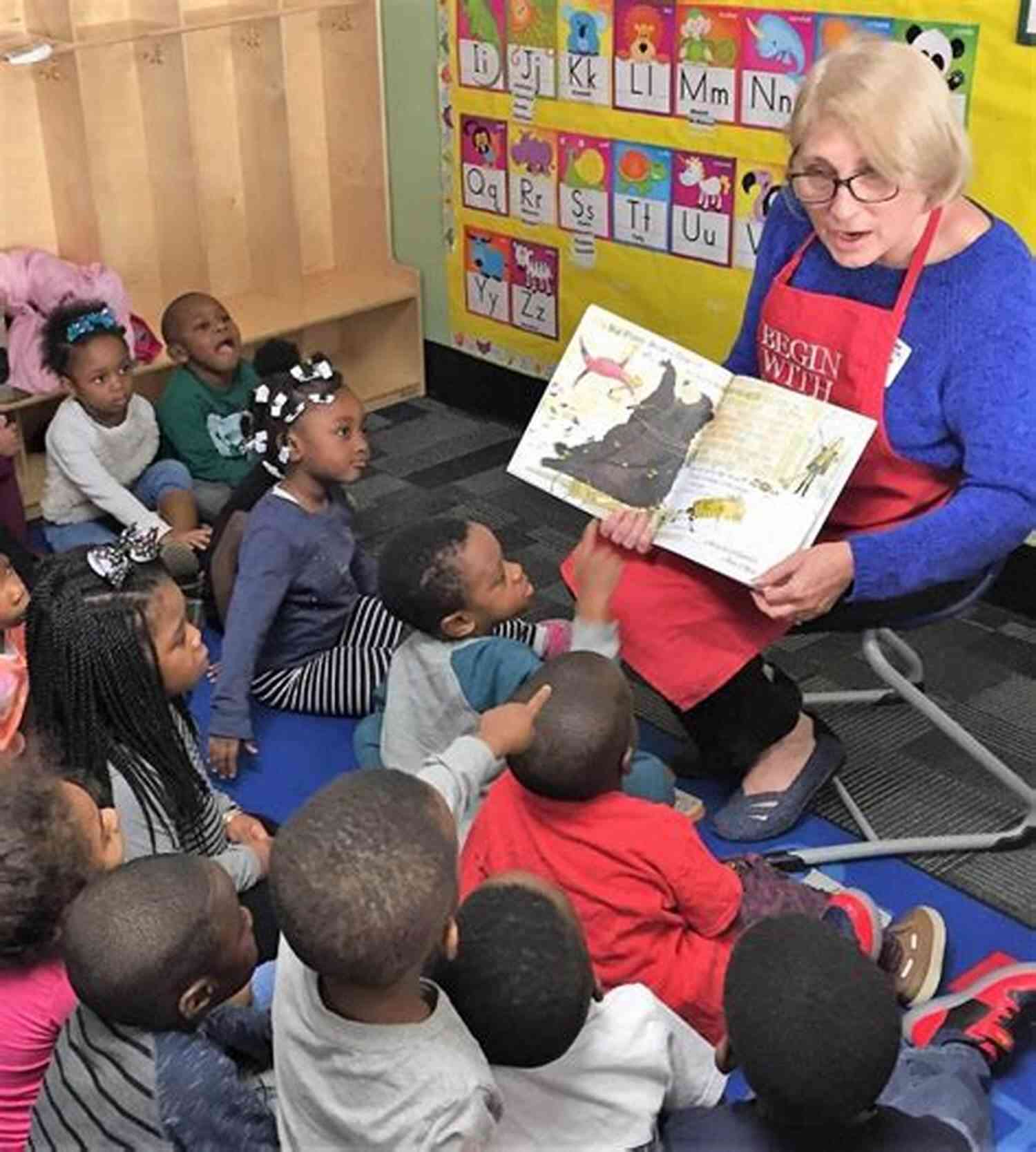 A Group Of Children Listen Intently As A Storyteller Captivates Them With A Magical Tale Superior Adventures Of Little Angels