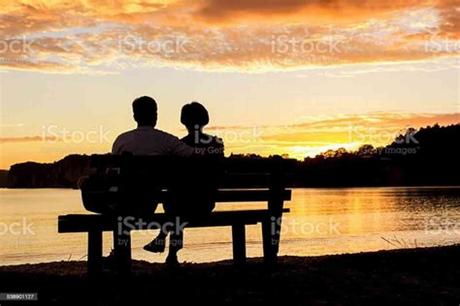 Couple Holding Hands While Watching A Glowing Sunset On A Beach A Timeless Journey Of Eternal Love