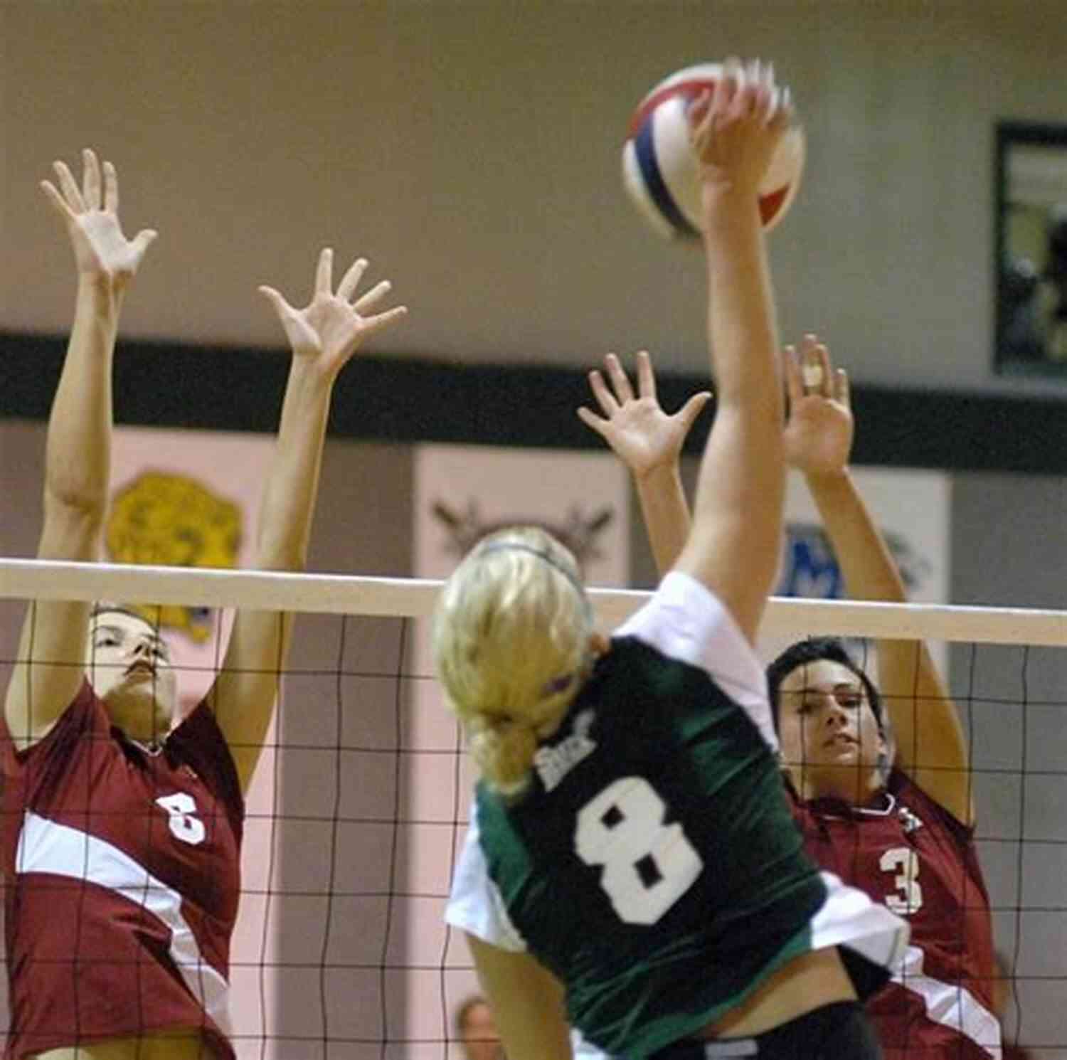 Two Players Spiking The Volleyball During A Thrilling Match HOW TO PLAY VOLLEYBALL: Beginner S Guide To Volleyball: Get Started Playing And Winning